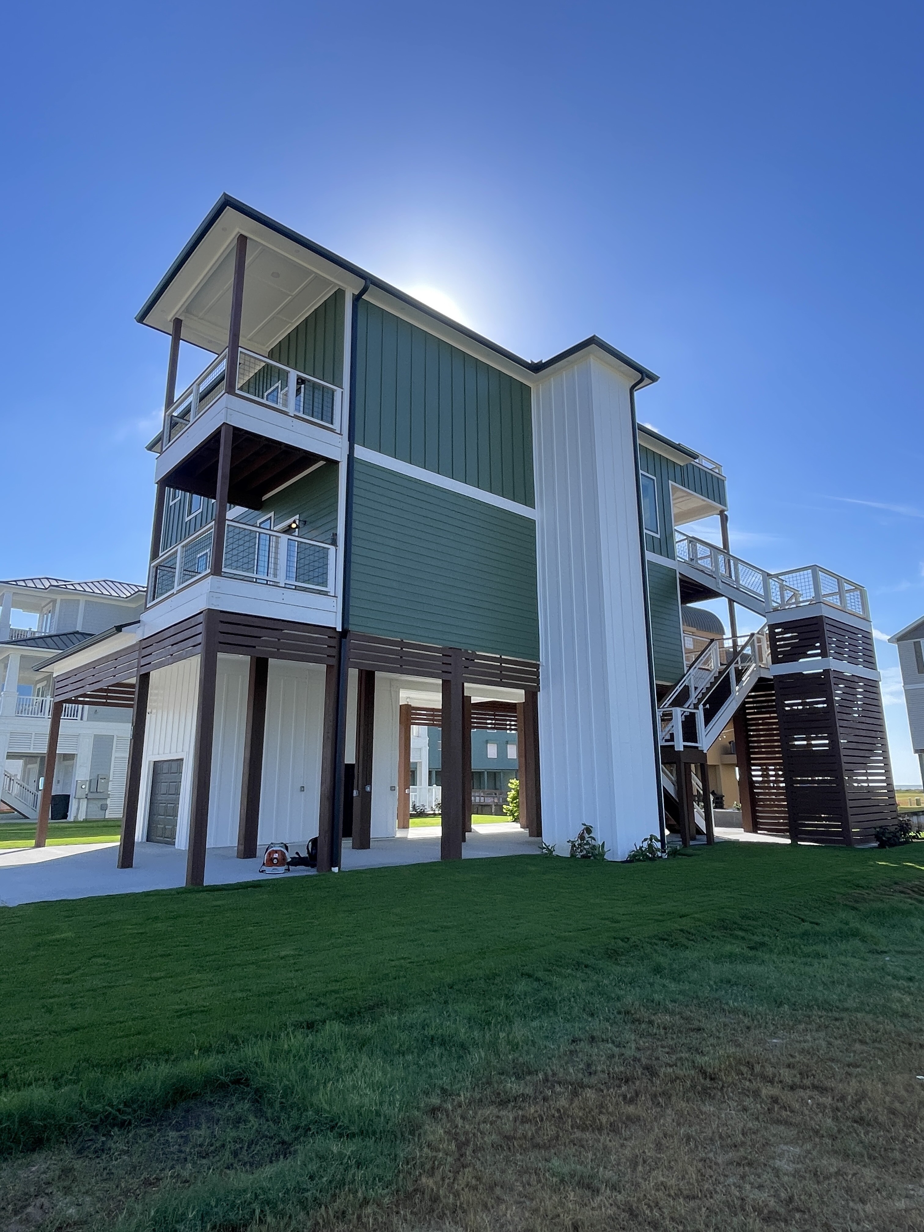 Coastal Cottage custom home exterior at dusk